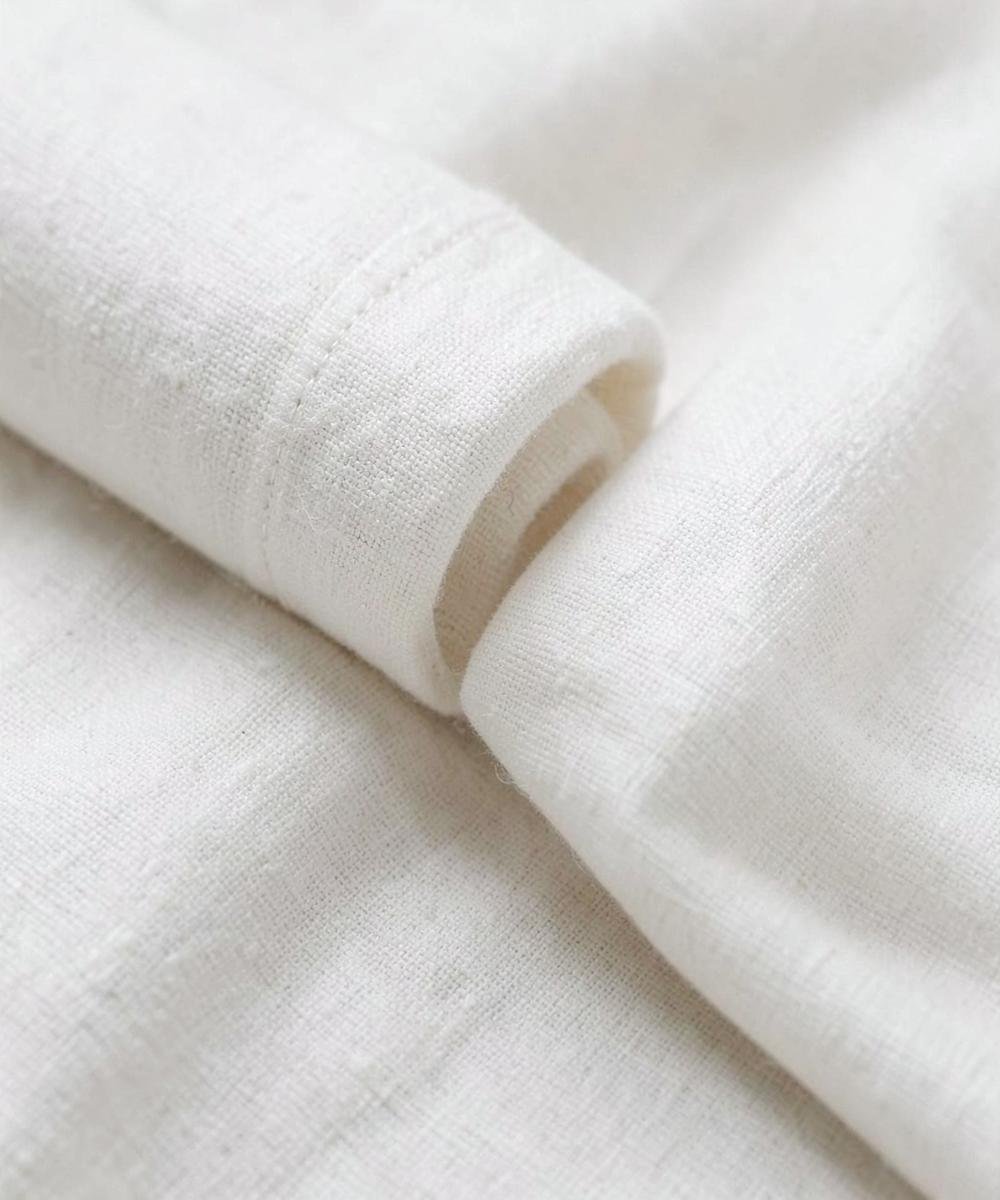 Rolls of natural off-white cotton fabric