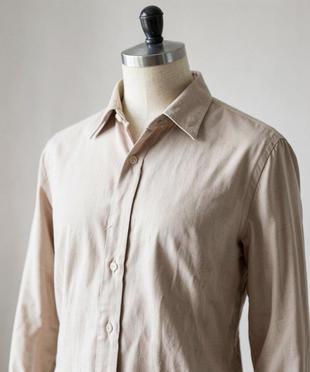 Tailored shirt in beige fabric on an atelier mannequin